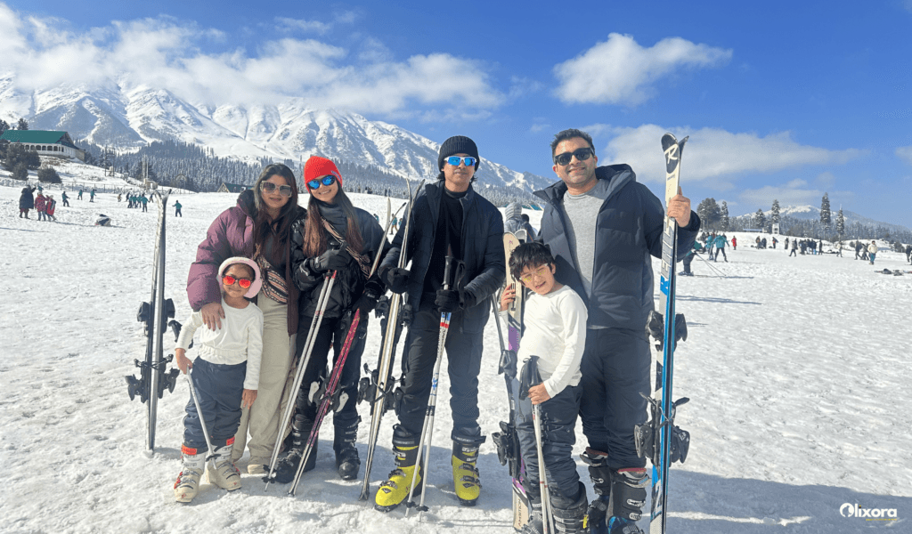 Skiers navigating a snowy trail during a winter ski in India